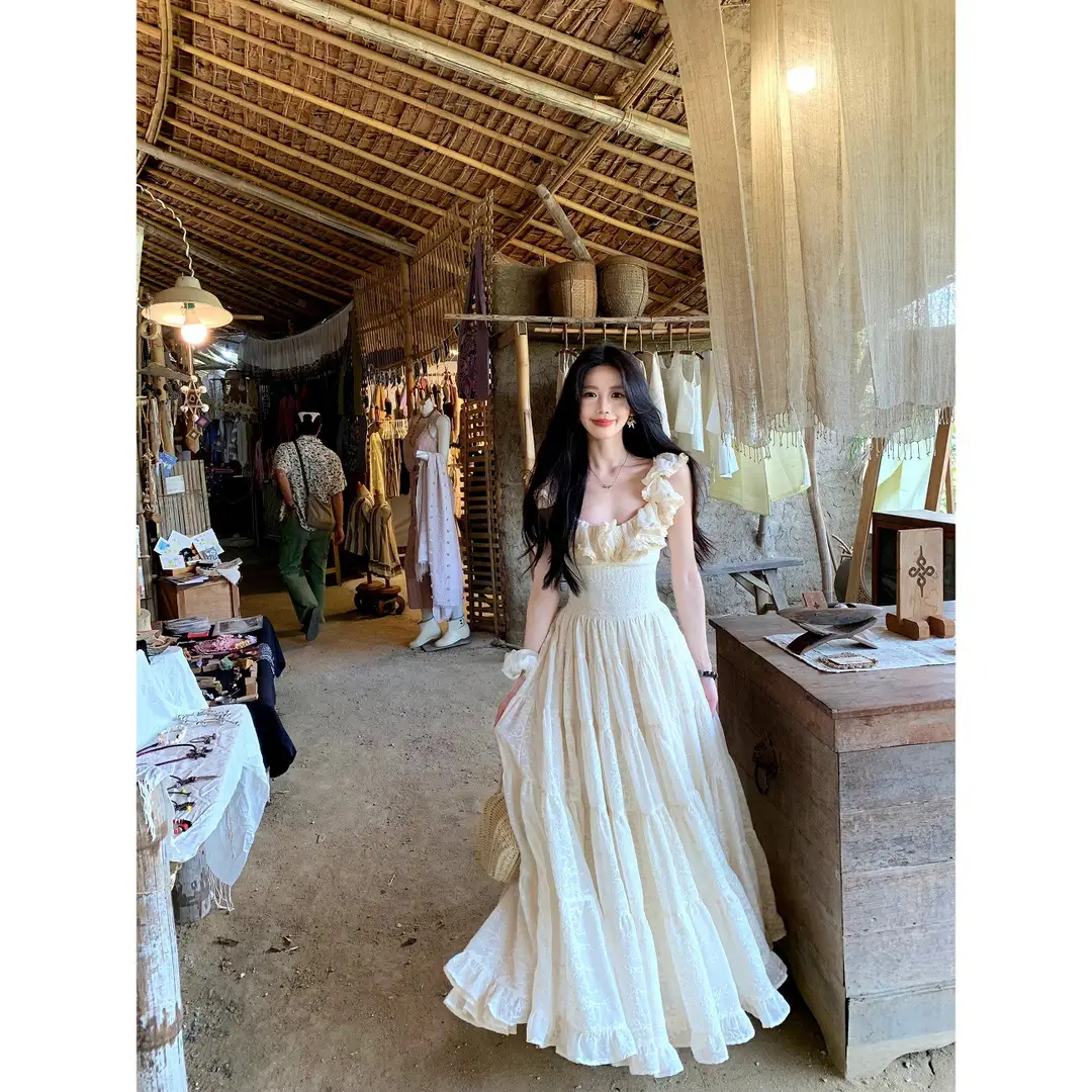 A Sweet Peach-Colored Yikett "Santorini" Heavy-Duty, Extra-Large Skirt Hem, Cinched Waist, Strap Dress for Women, Vacation Dress