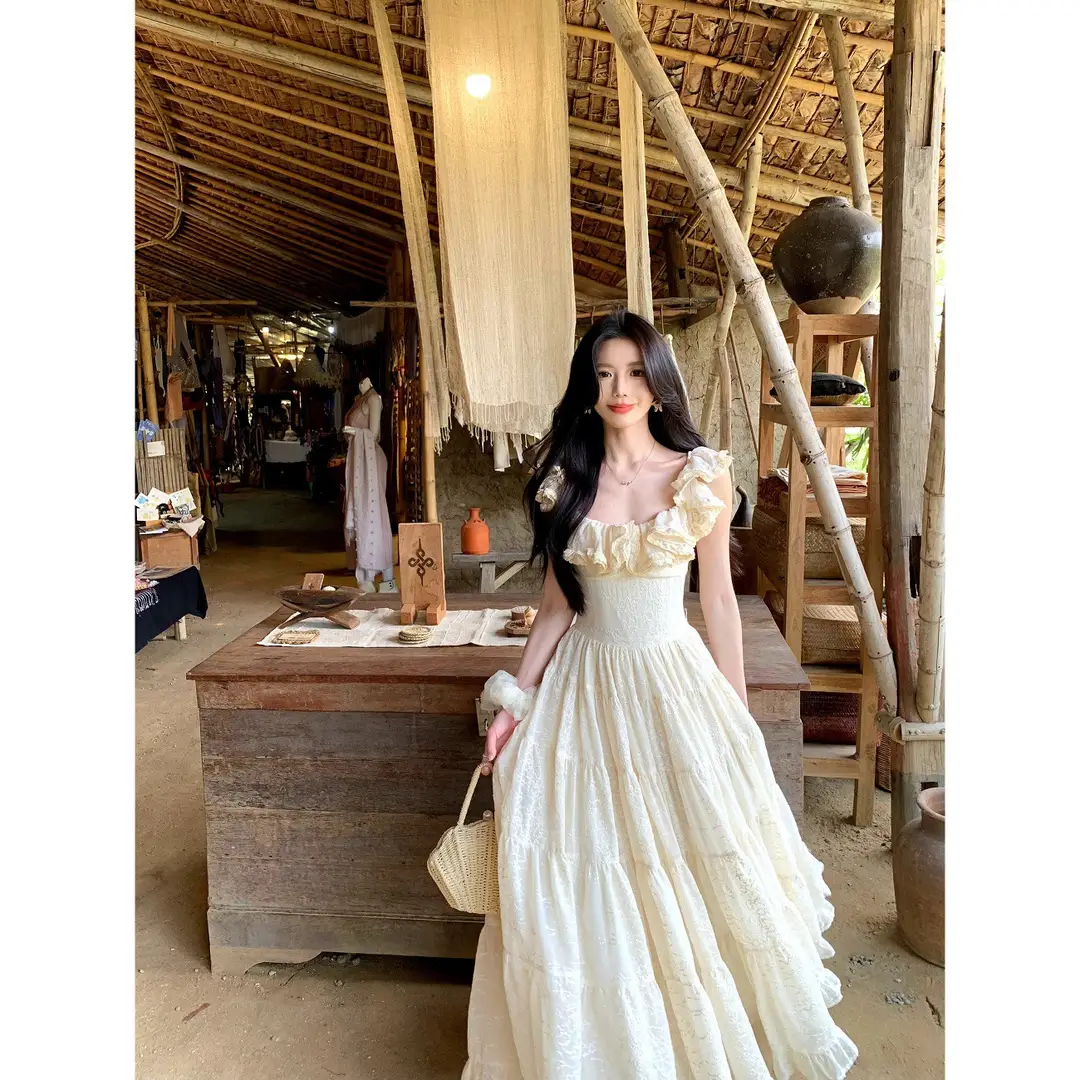 A Sweet Peach-Colored Yikett "Santorini" Heavy-Duty, Extra-Large Skirt Hem, Cinched Waist, Strap Dress for Women, Vacation Dress