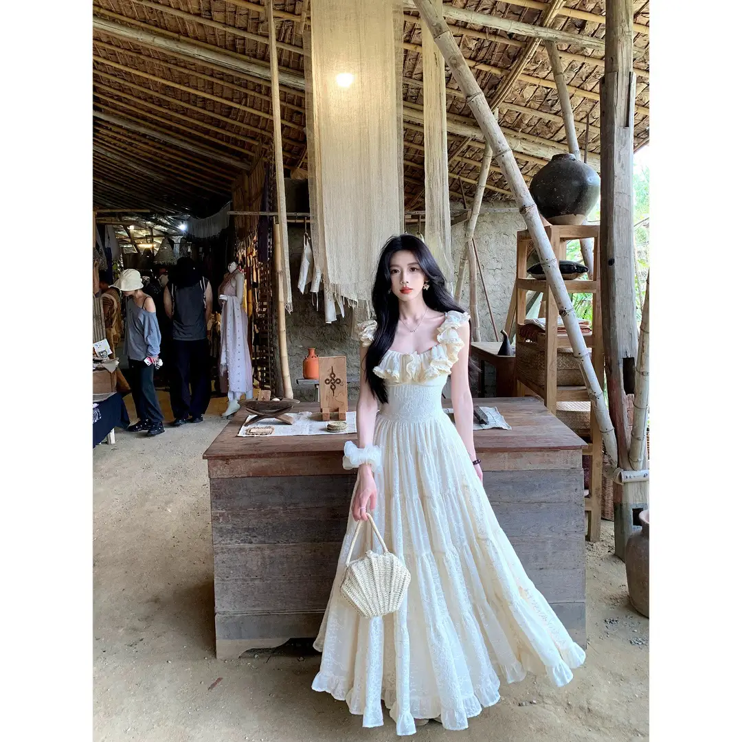 A Sweet Peach-Colored Yikett "Santorini" Heavy-Duty, Extra-Large Skirt Hem, Cinched Waist, Strap Dress for Women, Vacation Dress