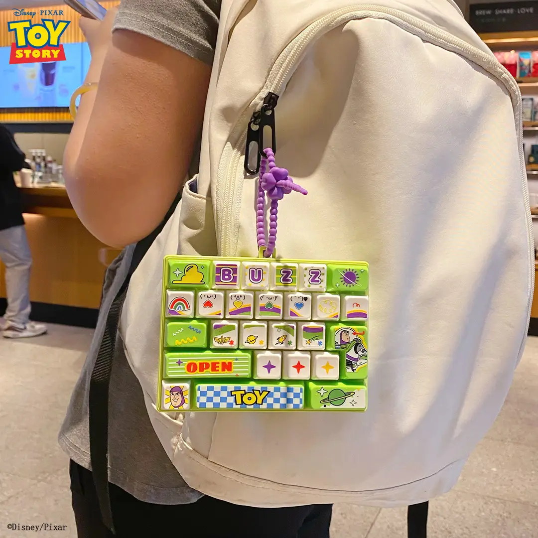 Authentic Toy Story 26-Key Keyboard with Pressable Keys, Portable Creative Stress-Relief Fingertip Toy, Student Pendant