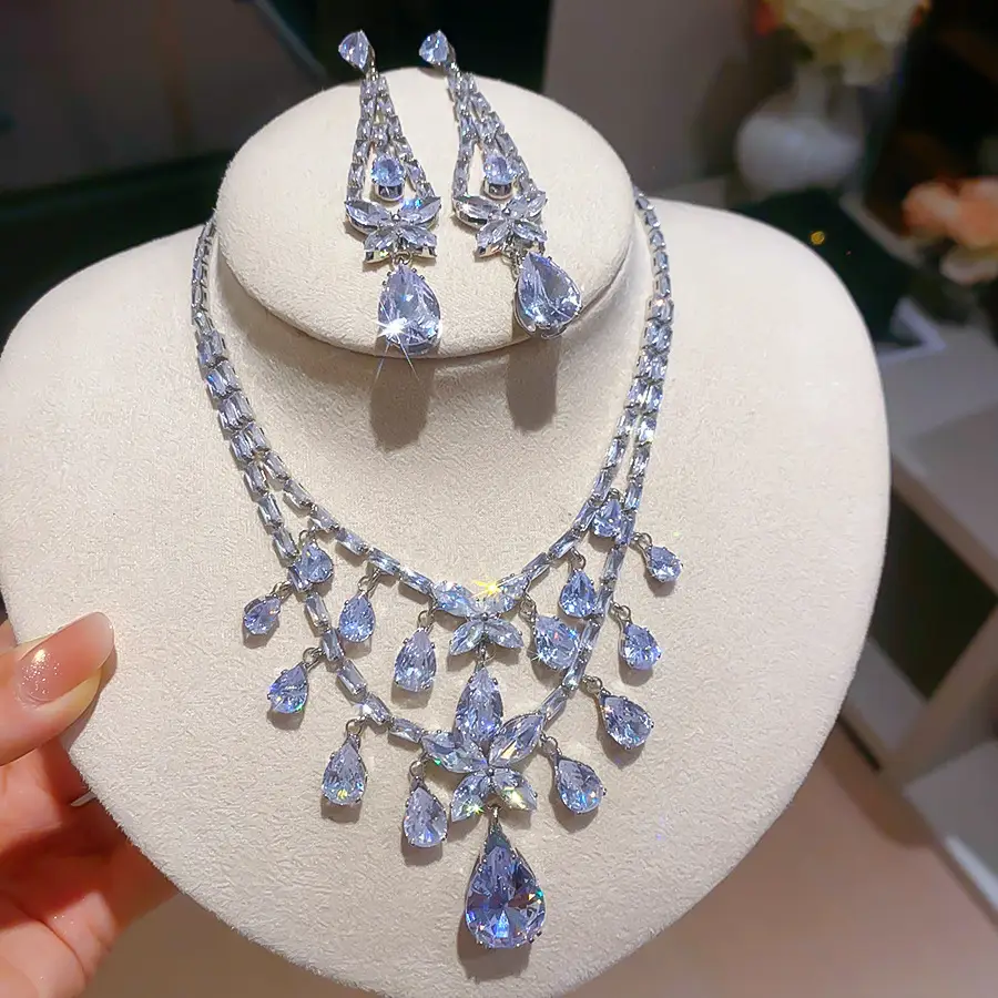 European and American style, featuring diamond-studded teardrop and geometric earrings and a necklace set, with a retro, courtly aesthetic, making it a fashionable and versatile accessory for women