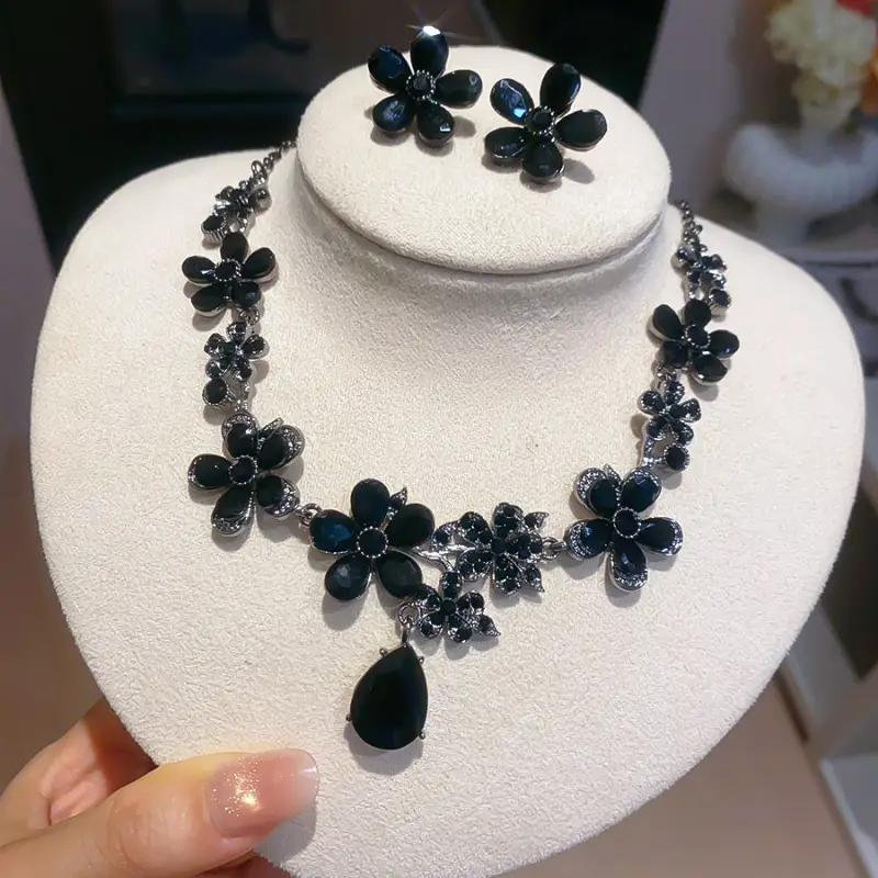 European and American style, featuring diamond-studded teardrop and geometric earrings and a necklace set, with a retro, courtly aesthetic, making it a fashionable and versatile accessory for women