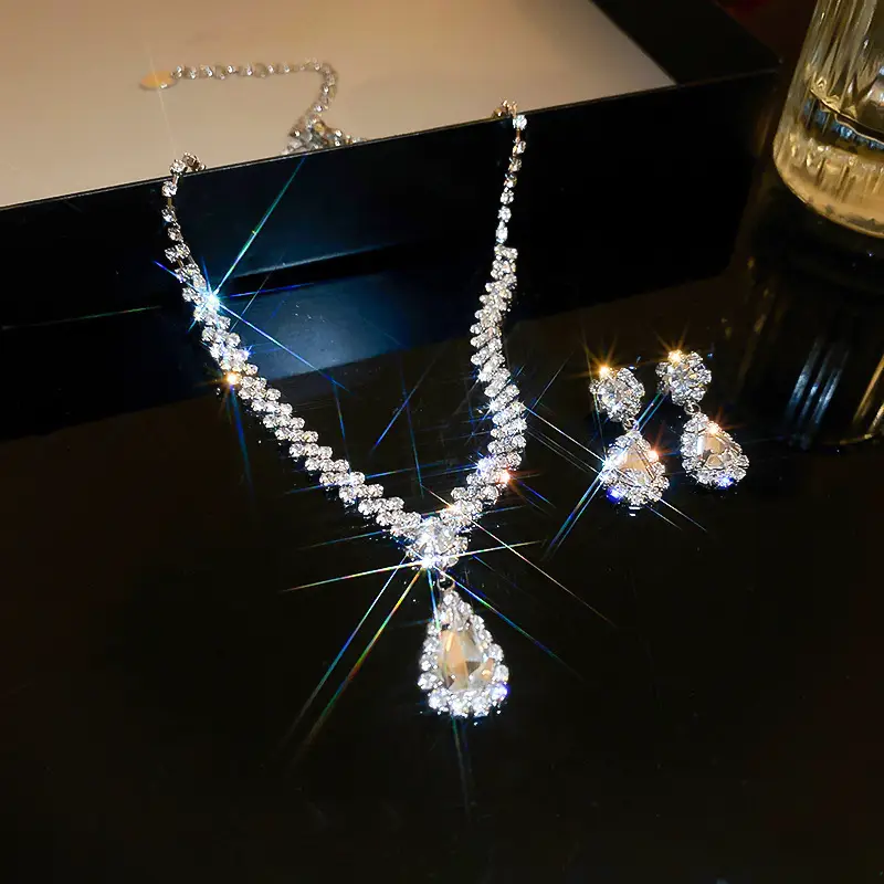 European and American style, featuring diamond-studded teardrop and geometric earrings and a necklace set, with a retro, courtly aesthetic, making it a fashionable and versatile accessory for women