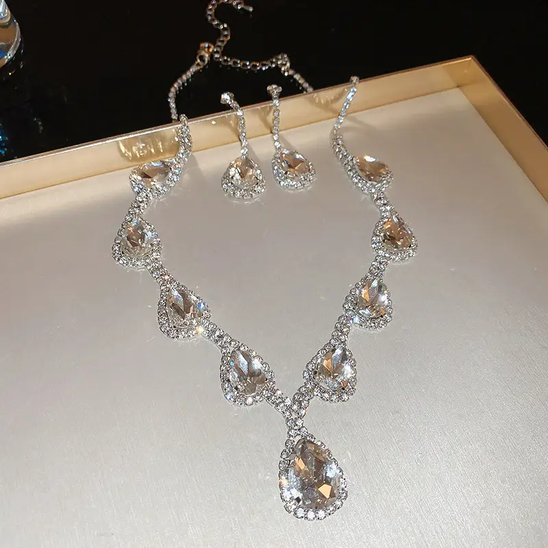 European and American style, featuring diamond-studded teardrop and geometric earrings and a necklace set, with a retro, courtly aesthetic, making it a fashionable and versatile accessory for women