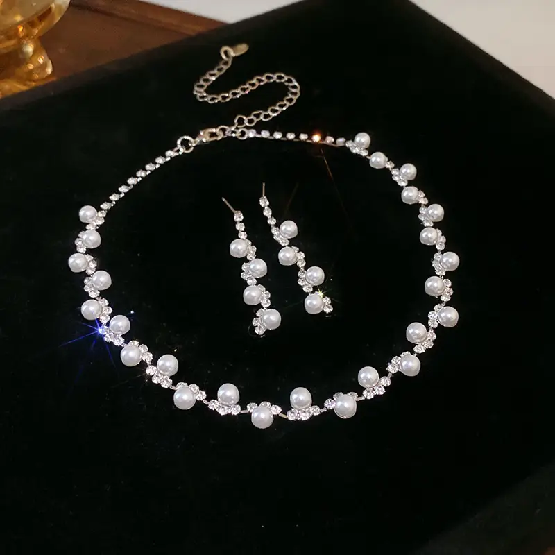 European and American style, featuring diamond-studded teardrop and geometric earrings and a necklace set, with a retro, courtly aesthetic, making it a fashionable and versatile accessory for women