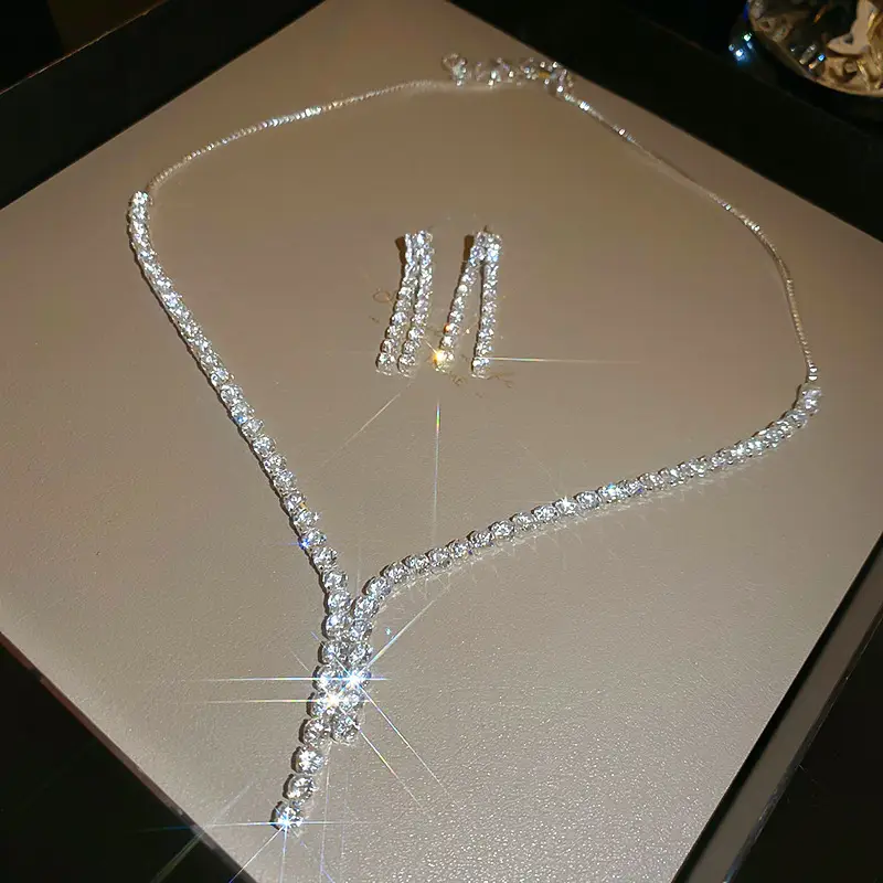 European and American style, featuring diamond-studded teardrop and geometric earrings and a necklace set, with a retro, courtly aesthetic, making it a fashionable and versatile accessory for women