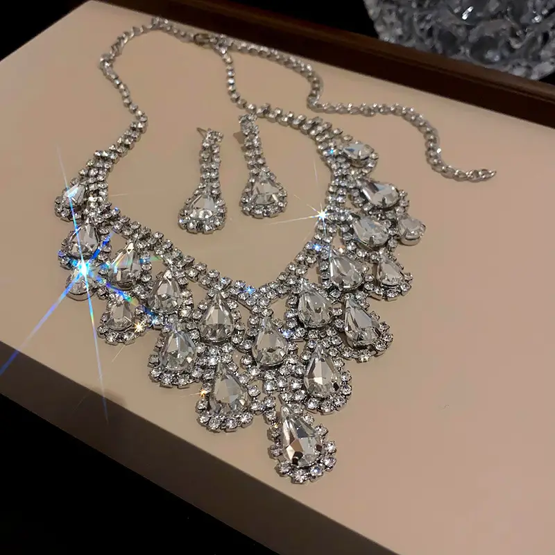 European and American style, featuring diamond-studded teardrop and geometric earrings and a necklace set, with a retro, courtly aesthetic, making it a fashionable and versatile accessory for women