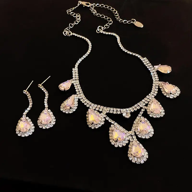 European and American style, featuring diamond-studded teardrop and geometric earrings and a necklace set, with a retro, courtly aesthetic, making it a fashionable and versatile accessory for women