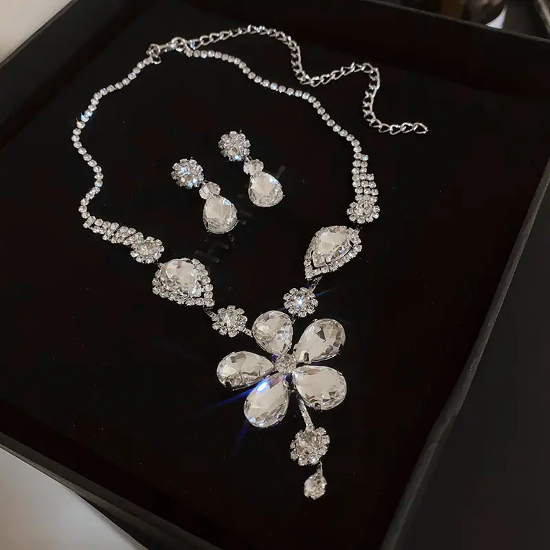 European and American style, featuring diamond-studded teardrop and geometric earrings and a necklace set, with a retro, courtly aesthetic, making it a fashionable and versatile accessory for women