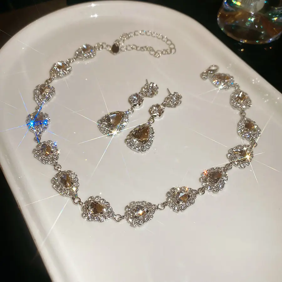 European and American style, featuring diamond-studded teardrop and geometric earrings and a necklace set, with a retro, courtly aesthetic, making it a fashionable and versatile accessory for women