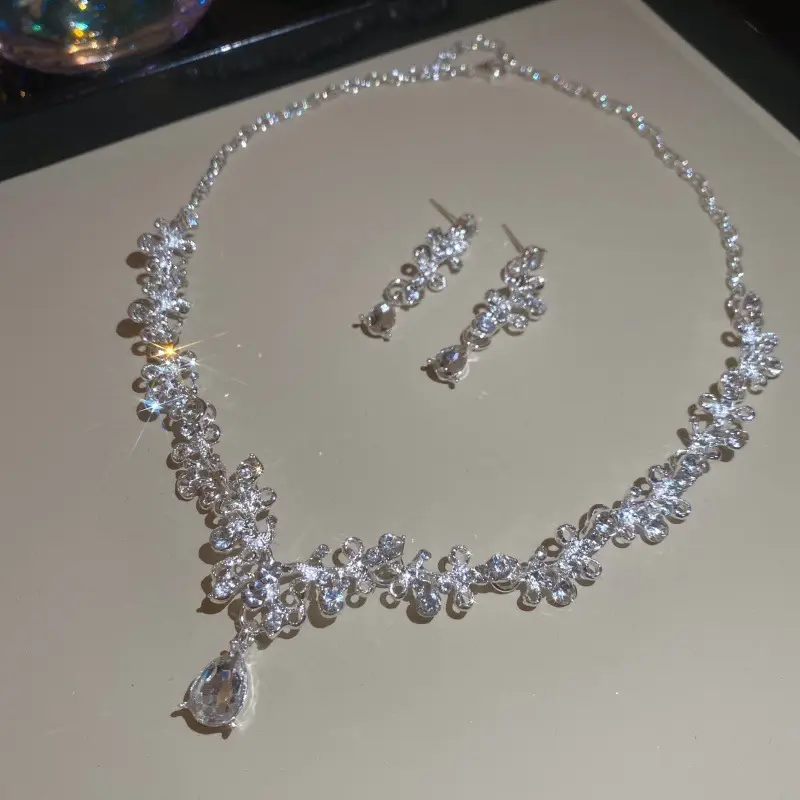 European and American style, featuring diamond-studded teardrop and geometric earrings and a necklace set, with a retro, courtly aesthetic, making it a fashionable and versatile accessory for women