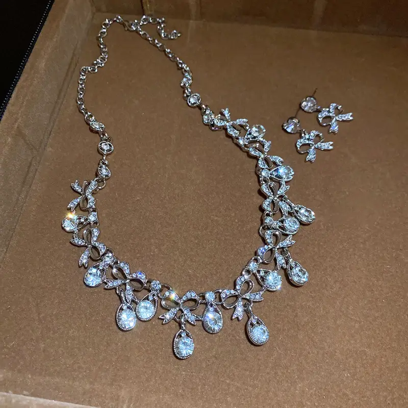 European and American style, featuring diamond-studded teardrop and geometric earrings and a necklace set, with a retro, courtly aesthetic, making it a fashionable and versatile accessory for women