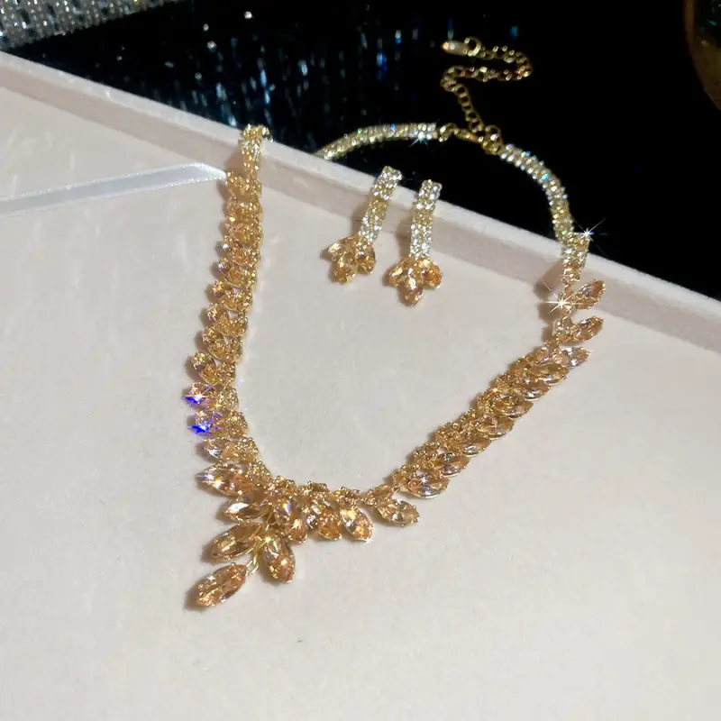 European and American style, featuring diamond-studded teardrop and geometric earrings and a necklace set, with a retro, courtly aesthetic, making it a fashionable and versatile accessory for women