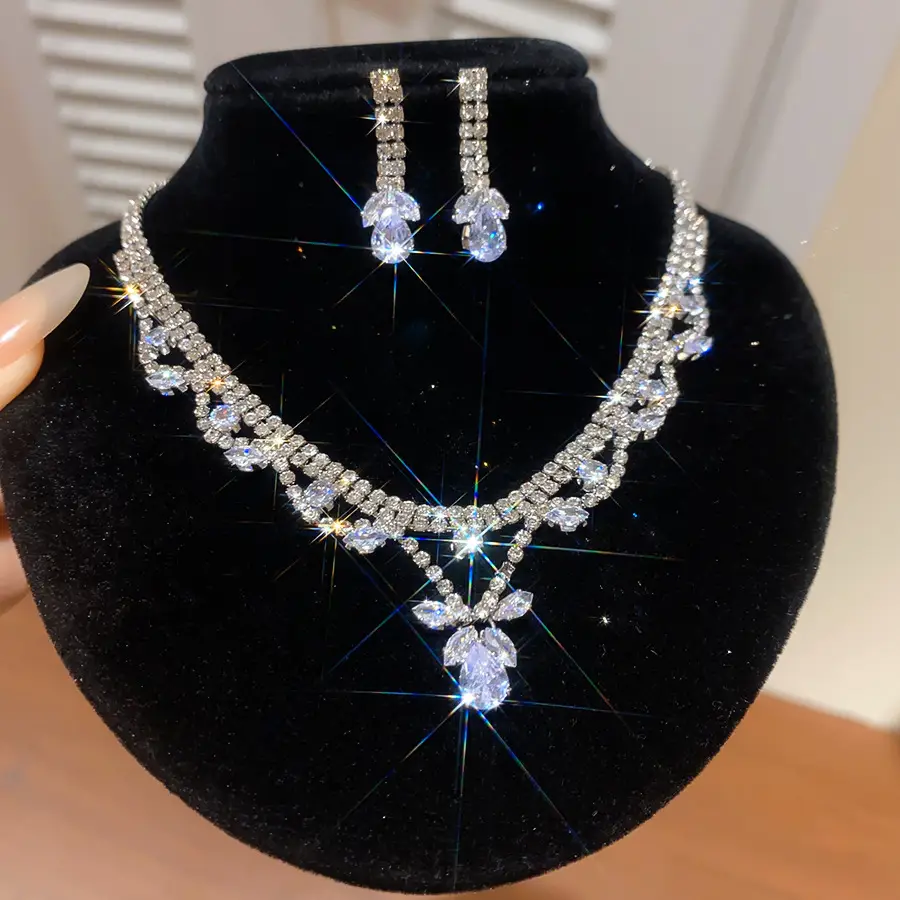European and American style, featuring diamond-studded teardrop and geometric earrings and a necklace set, with a retro, courtly aesthetic, making it a fashionable and versatile accessory for women