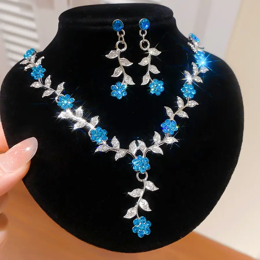 European and American style, featuring diamond-studded teardrop and geometric earrings and a necklace set, with a retro, courtly aesthetic, making it a fashionable and versatile accessory for women