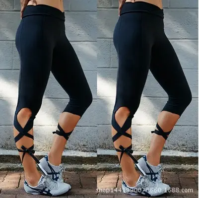Women Black Cross Strap Yoga Leggings with White Sneakers - Image 2