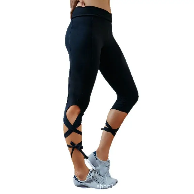 Women Black Cross Strap Yoga Leggings with White Sneakers - Image 6