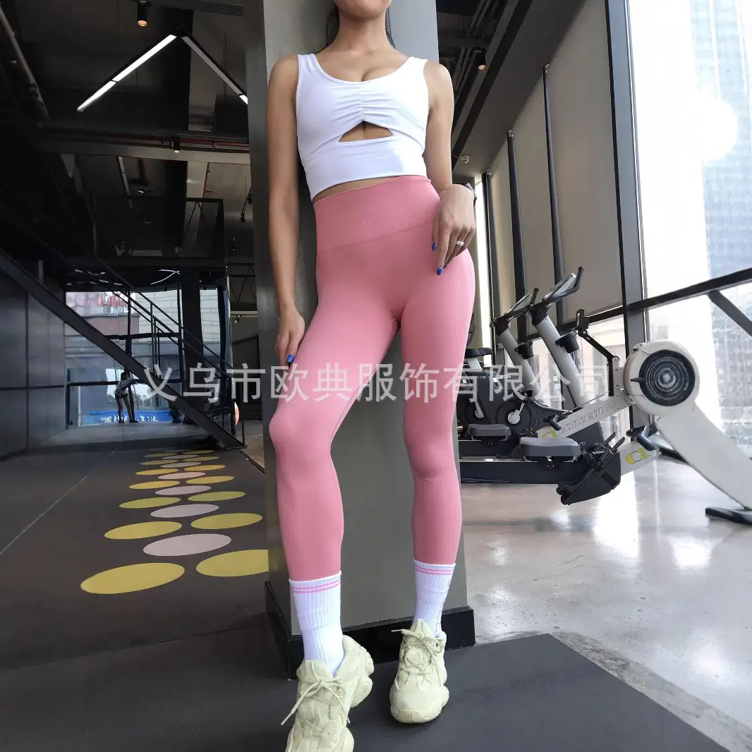 Red Seamless Fitness Pants for Women with White Sneakers - Image 3
