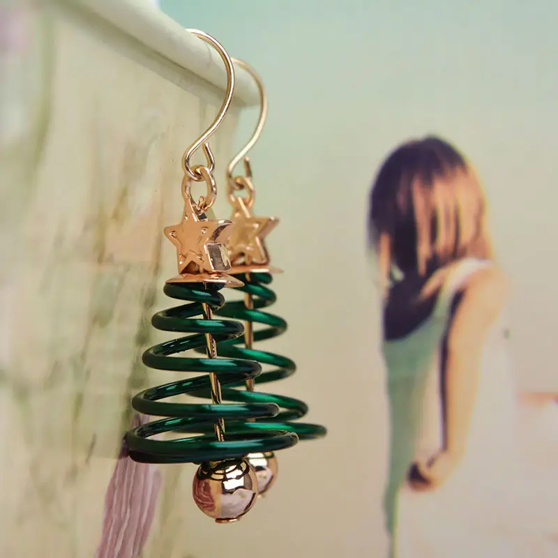 Golden Spring Earrings with Star and Bell Design - Image 3
