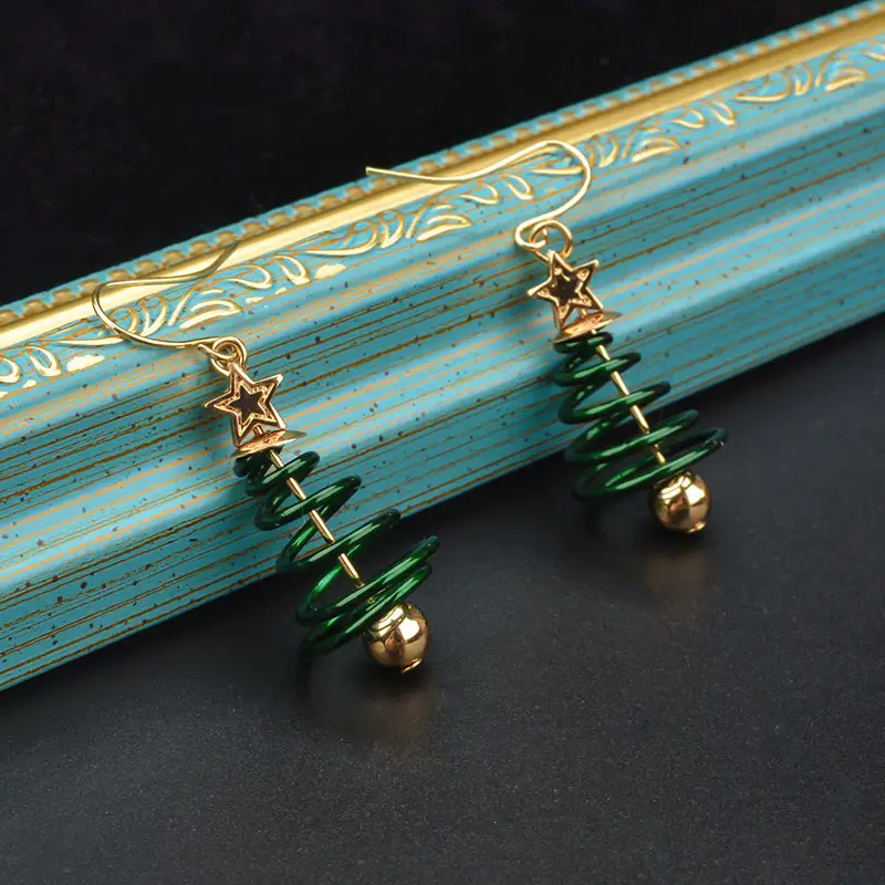 Golden Spring Earrings with Star and Bell Design - Image 4