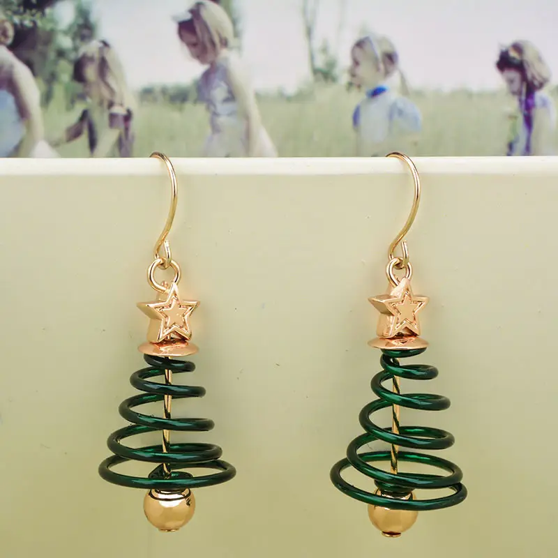Golden Spring Earrings with Star and Bell Design - Image 5