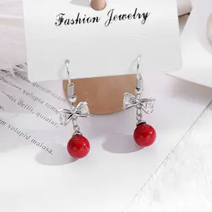 Golden Spring Earrings with Star and Bell Design — feature 3
