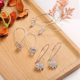 Golden Spring Earrings with Star and Bell Design — feature 5