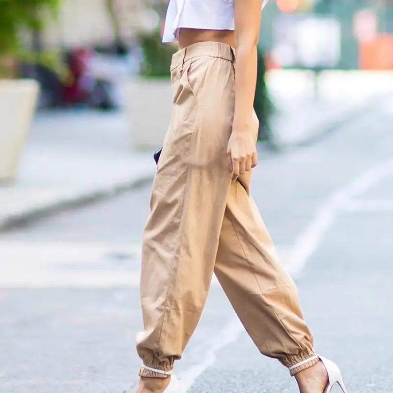 Women's White Crossbody Belt Pants with Black Boots — feature 5