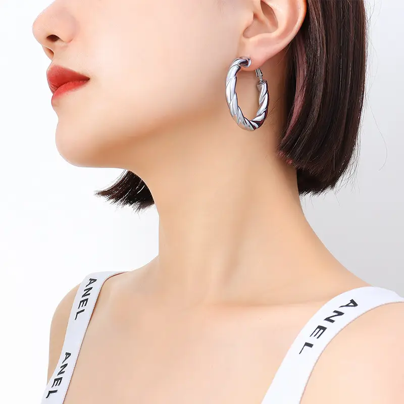 French Style Hollow Gold Earrings with Titanium Plated - Image 2