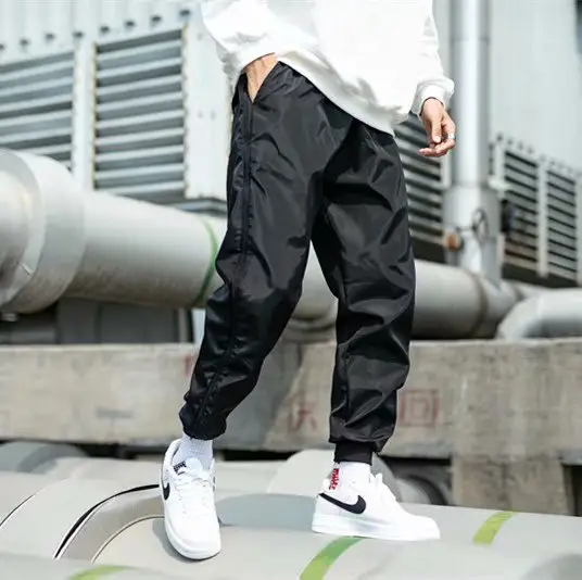 Men Black Side Zipper Hip Hop Pants with White Sneakers — feature 9