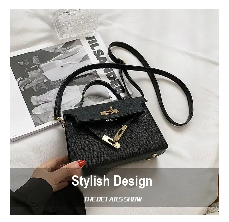 Black bag with long shoulder strap and top handle