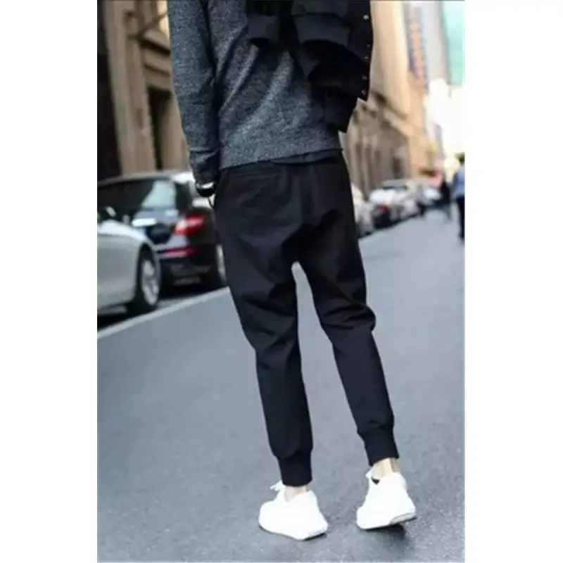 Men's Black Slim Fit Sports Pants with White Sneakers - Image 4