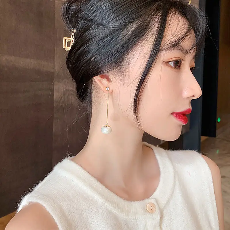 Long Tassel Pearl Earrings with Diamond Top - Image 7