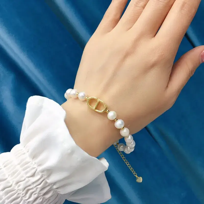 White Pearl Bracelet with Gold Plated D-Logo - Image 2