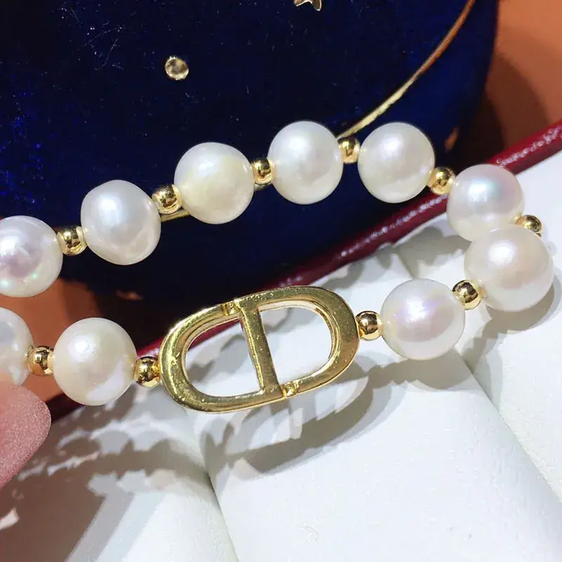White Pearl Bracelet with Gold Plated D-Logo - Image 4
