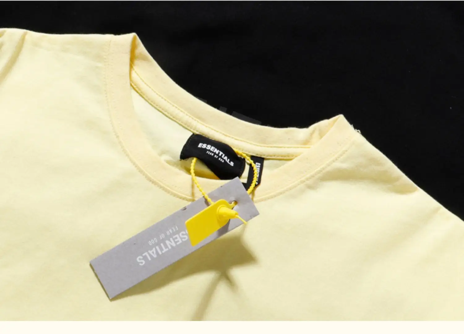 White Loose Fit T-Shirt with "Essentials" Print — feature 24