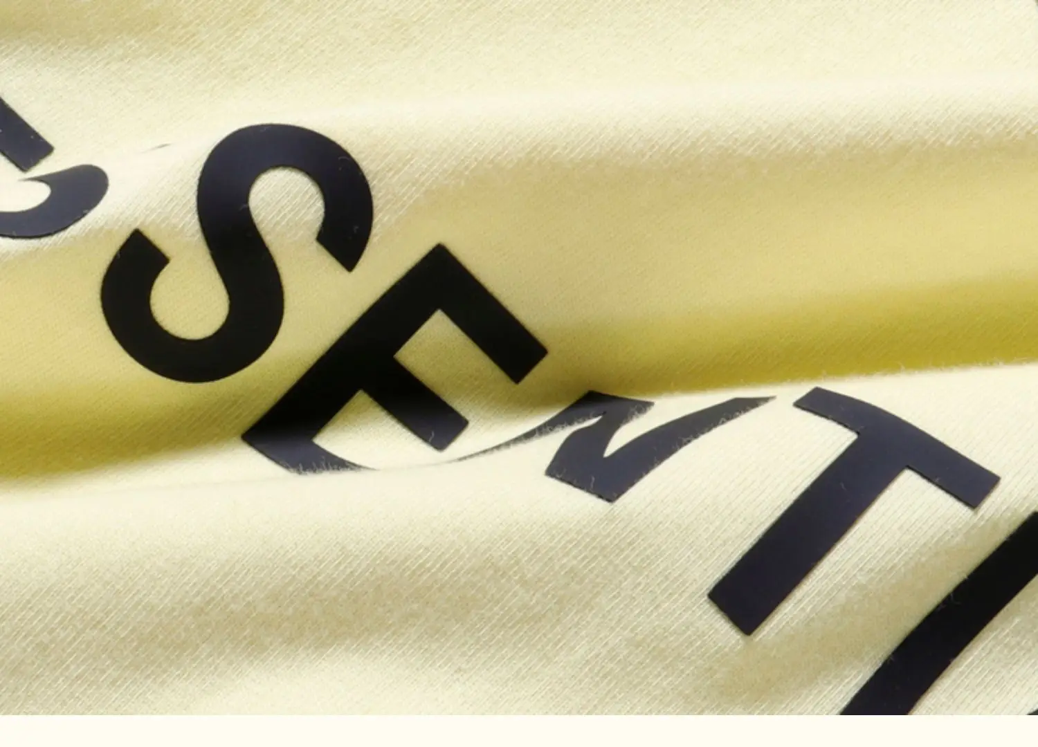 White Loose Fit T-Shirt with "Essentials" Print — feature 25