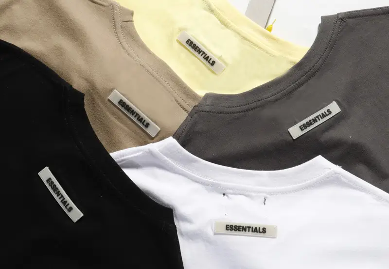 White Loose Fit T-Shirt with "Essentials" Print — feature 29