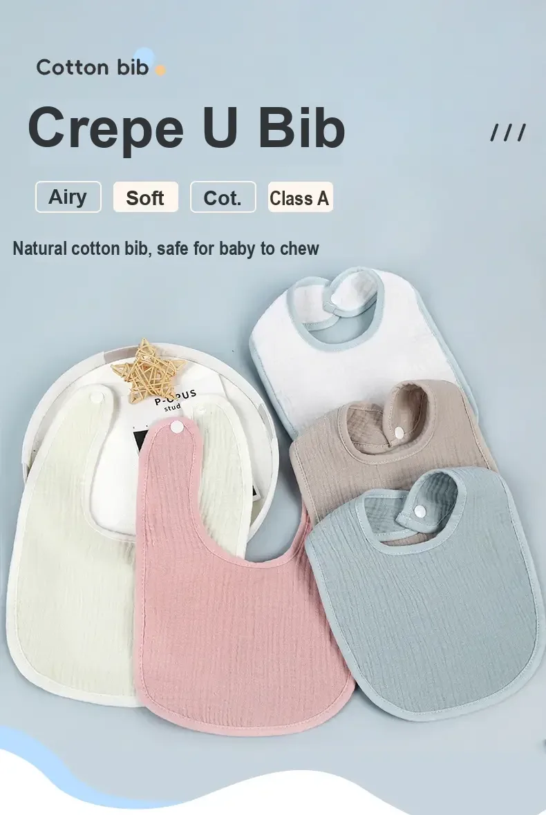 White, pink, grey and light blue cotton gauze bibs arranged together.