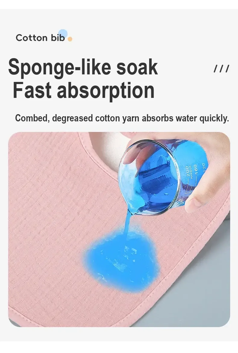 Water being poured onto a pink bib to illustrate absorption.