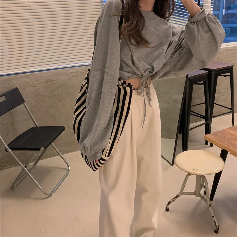 White Long Sleeve Top with High Waist Jeans for Women — feature 29