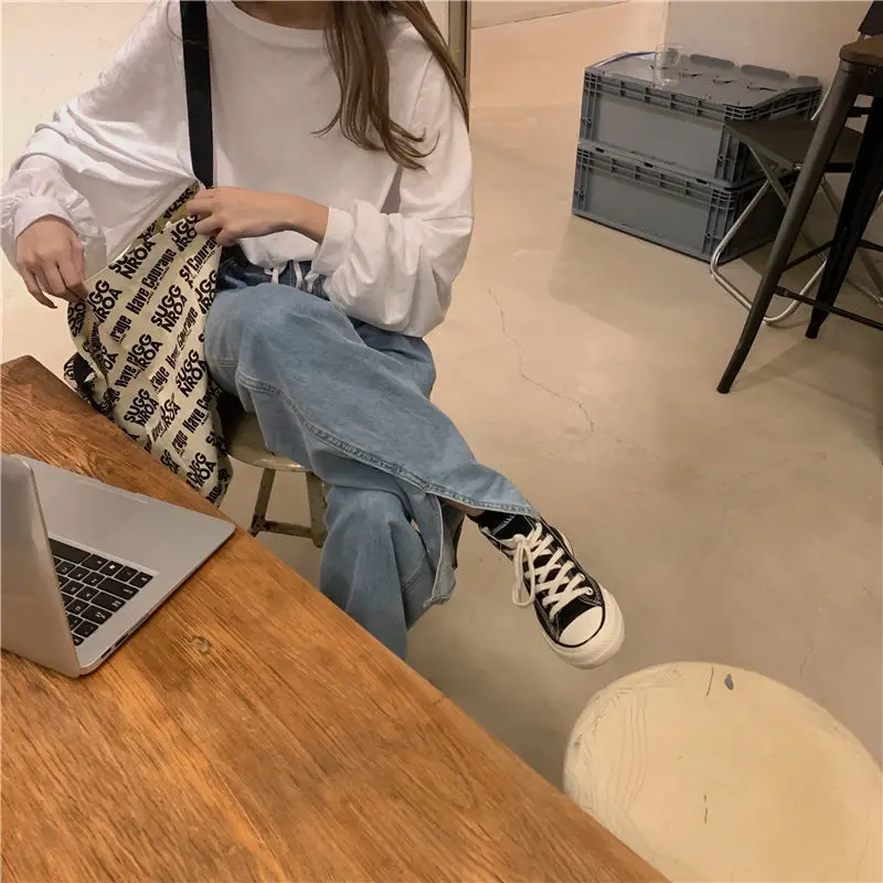 White Long Sleeve Top with High Waist Jeans for Women — feature 9