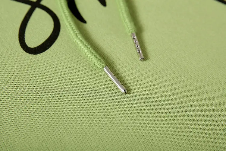 Green Printed Hoodie with "Smile" Text — feature 19