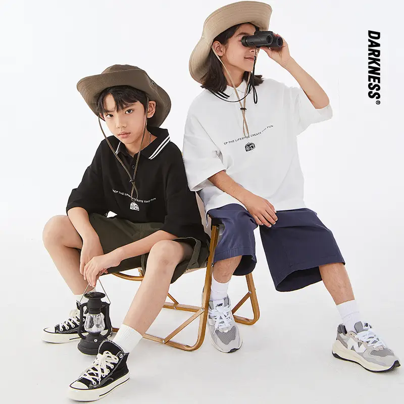 Kids Black Polo Shirt with White Trim - Image 2