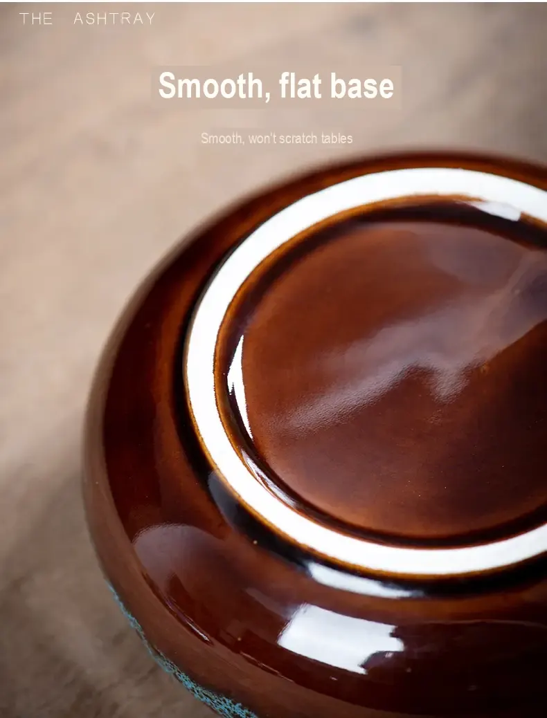 Close-up of the smooth glazed underside of a ceramic ashtray.