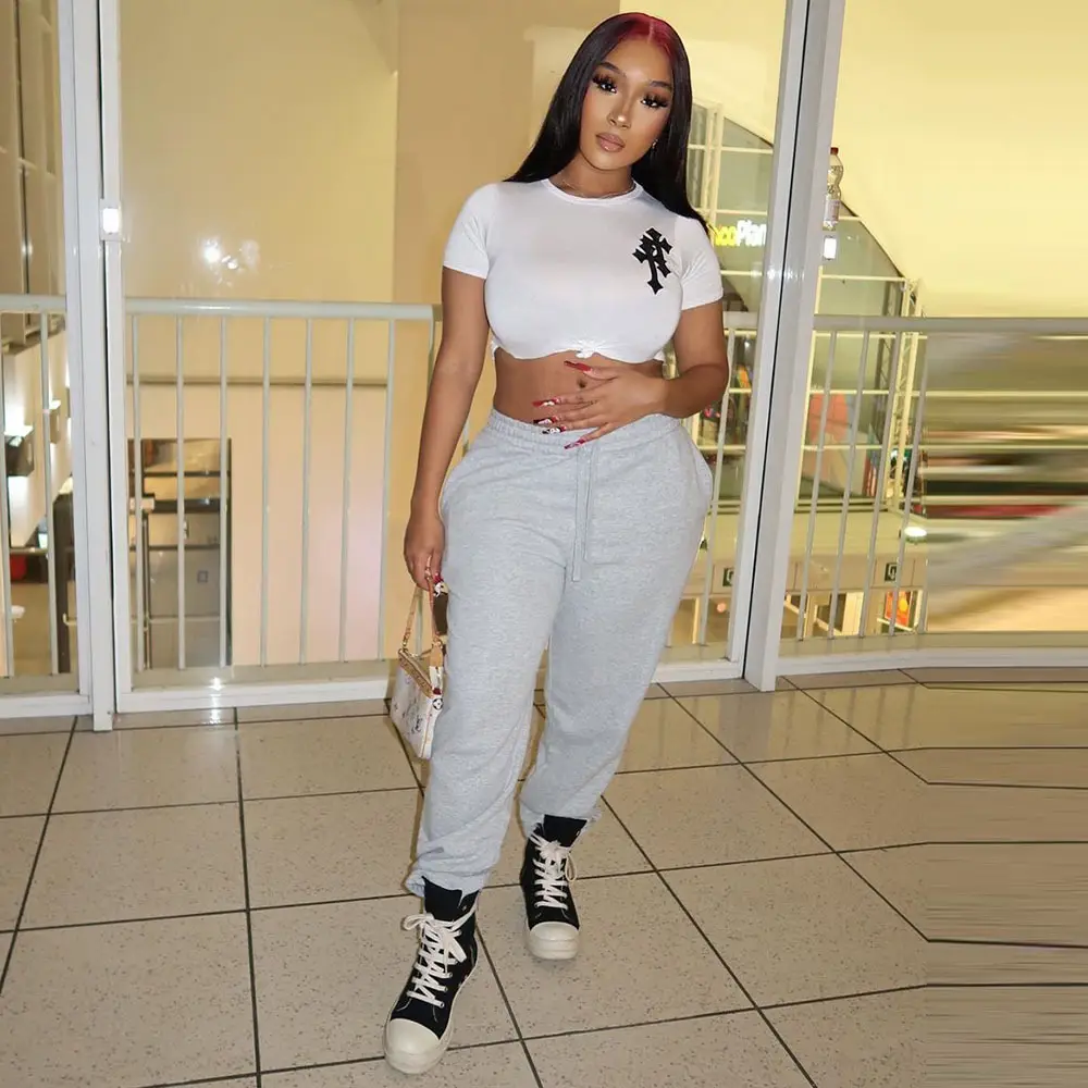 Women White Crop Top T-Shirt with Black Graphic High Heel Pants - Image 4