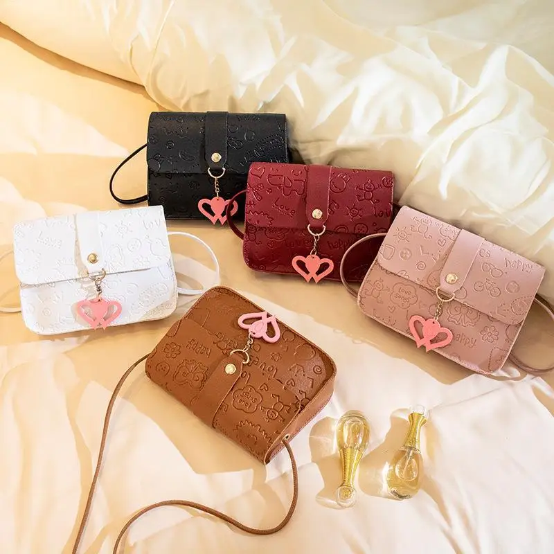 Pink Embossed Ladies Shoulder Bag with Heart Pendant - Image 10