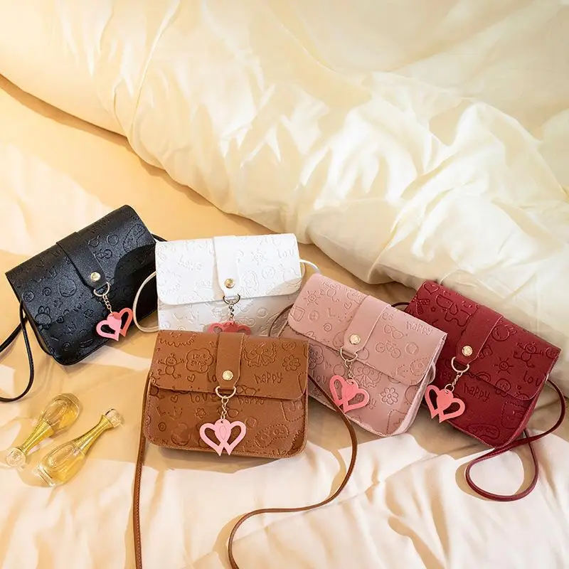 Pink Embossed Ladies Shoulder Bag with Heart Pendant - Image 7