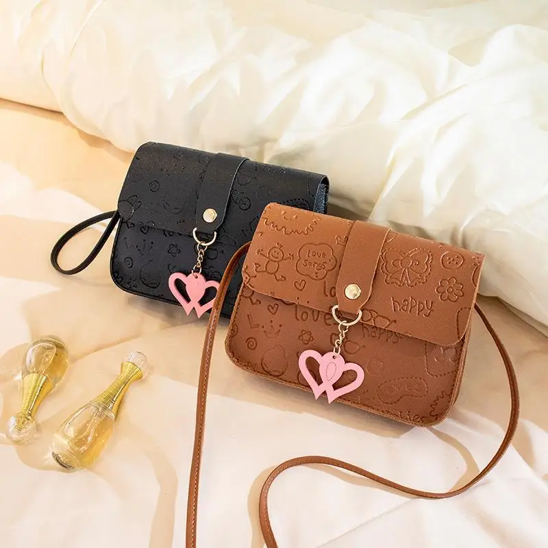 Pink Embossed Ladies Shoulder Bag with Heart Pendant - Image 8