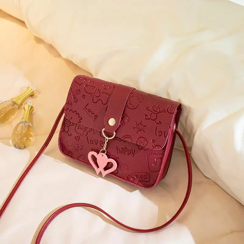 Pink Embossed Ladies Shoulder Bag with Heart Pendant - Image 2